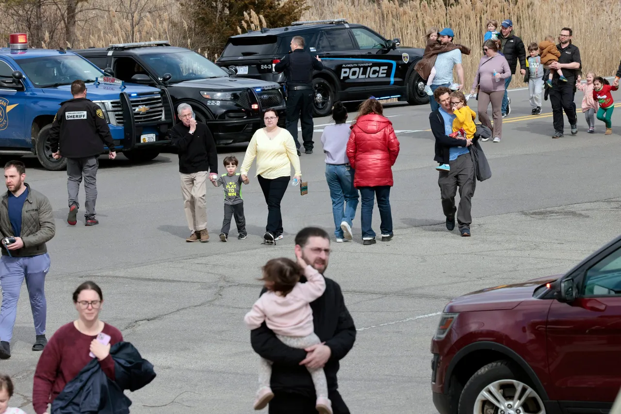 Families leave after being reunited outside Temple Israel synagogue after an assailant rammed his truck into the building in West Bloomfield, Michigan, a suburb of Detroit, on March 12, 2026. (Photo by Jeff Kowalsky/AFP via Getty Images)