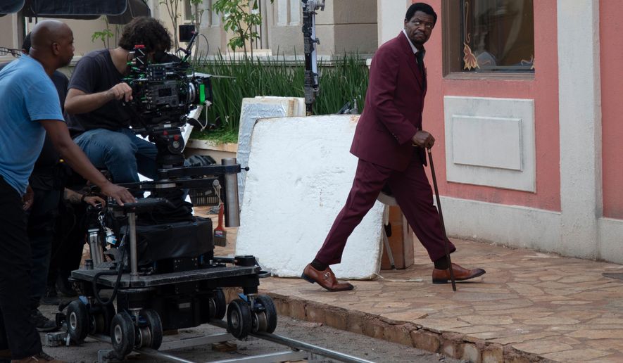 Actor Bukassa Kabengele, right, takes part in the filming of the soap opera "A Nobreza do Amor" at a TV Globo set in Rio de Janeiro, Thursday, March 12, 2026. (AP Photo/Bruna Prado)