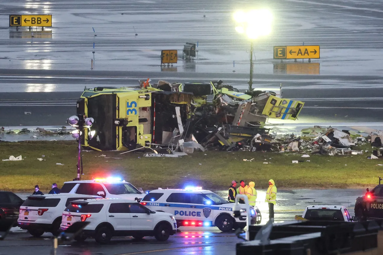 A damaged Port Authority fire truck sits near the runway after colliding with an Air Canada Express CRJ-900 at LaGuardia Airport in New York, on March 23, 2026. A plane carrying dozens of people collided with a fire truck on a runway at New York's LaGuardia airport, killing the pilot and co-pilot and causing "serious injuries" to others, authorities said Monday. Due to the crash late Sunday, US aviation authorities halted all flights at LaGuardia, and the port authority said the airport would stay shut until at least 2:00 pm (1800 GMT) "to allow for a thorough investigation." (Photo by TIMOTHY A. CLARY / AFP via Getty Images)