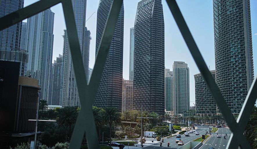 Light traffic moves along a main road in downtown Dubai, United Arab Emirates, Tuesday, March 3, 2026. (AP Photo/ Fatima Shbair)