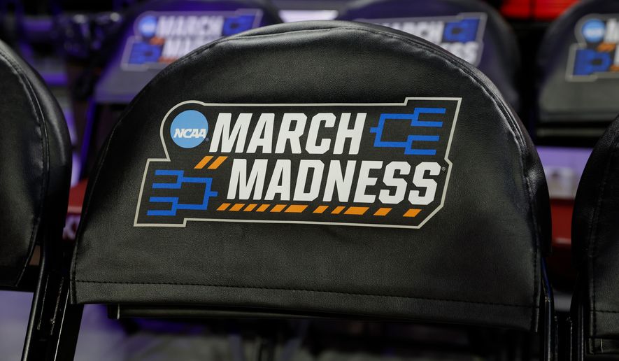 March Madness signage is displayed on chairs before a game between Colorado State and Michigan State in the first round of the NCAA college basketball tournament, Friday, March 20, 2026, Norman, Okla. (AP Photo/Alonzo Adams)