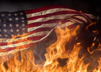 Radical Anti-ICE Extremist Accidentally Sets Himself on Fire While Burning American Flag [WATCH]
