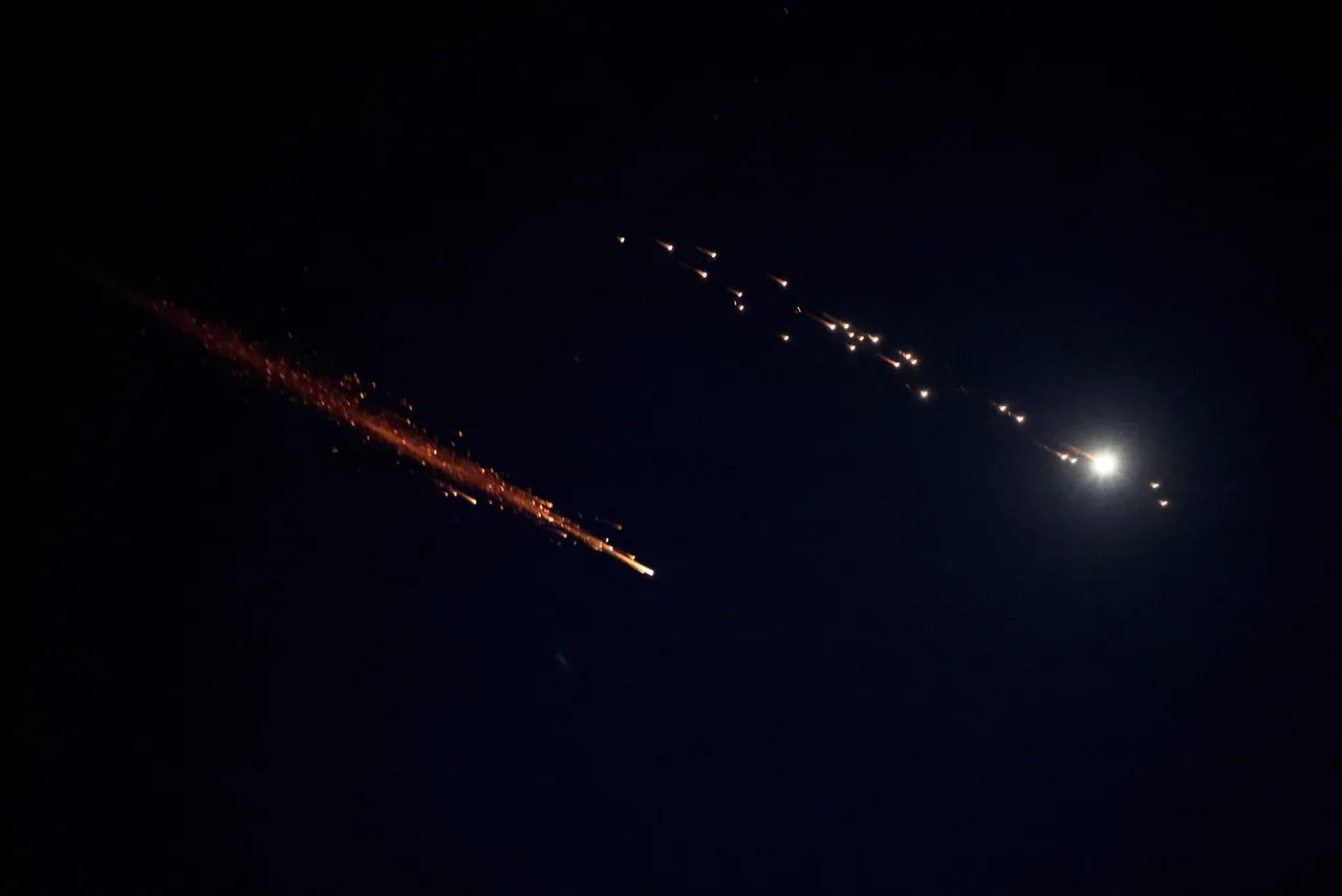 Rocket trails are seen in the sky above the Israeli center coastal city of Netanya amid a fresh barrage of Iranian missile attacks on March 9, 2026. Israel announced a new wave of 