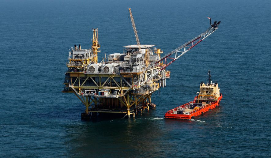 A supply vessel boat sits near an oil rig in the Gulf of Mexico, off the coast of Louisiana, on April 10, 2011. (AP Photo/Gerald Herbert) **FILE**