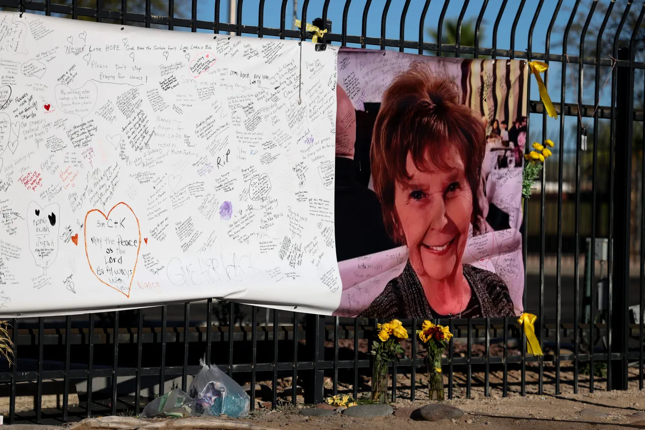 TUCSON, ARIZONA - FEBRUARY 26: A photograph of Nancy Guthrie is seen on a sign that people can leave messages on February 26, 2026, in Tucson, Arizona. Law enforcement officials continue to search for Nancy Guthrie, the 84-year-old mother of U.S. journalist and television host Savannah Guthrie, after she went missing from her home on the morning of February 1st. (Photo by Joe Raedle/Getty Images)