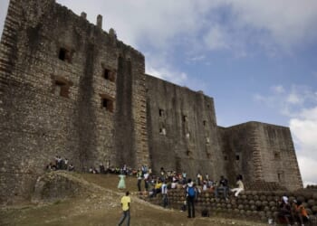 A stampede at a Haitian mountaintop fortress kills at least 25 people and injures dozens