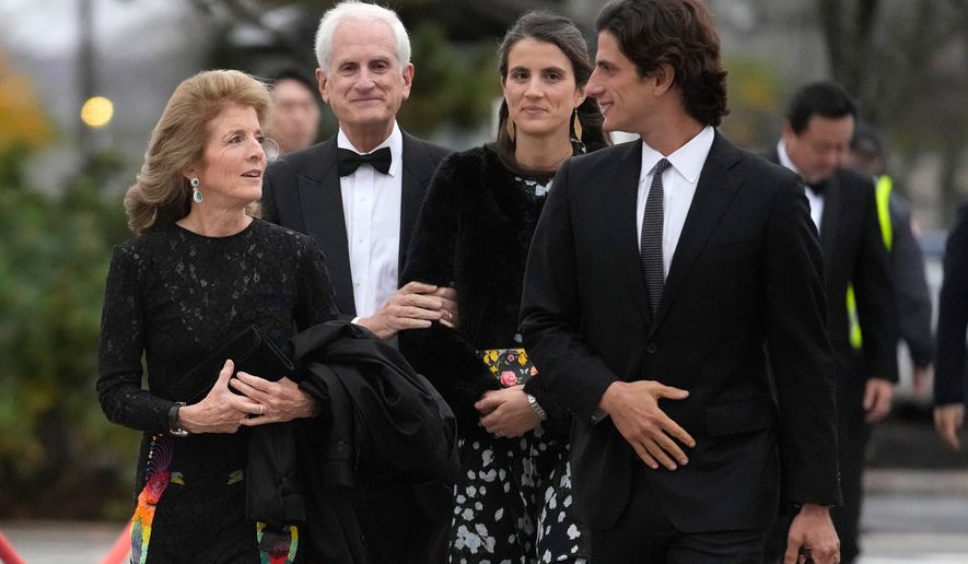 Caroline Kennedy, ambassador of the United States to Australia, left, arrives with her husband, Edwin Schlossberg, center left, and her children, Tatiana Schlossberg, center right, and Jack Schlossberg, right, Oct. 29, 2023, before the presentation ceremony for the John F. Kennedy Profile in Courage Award at the John F. Kennedy Presidential Library and Museum, in Boston. (AP Photo/Steven Senne, File)