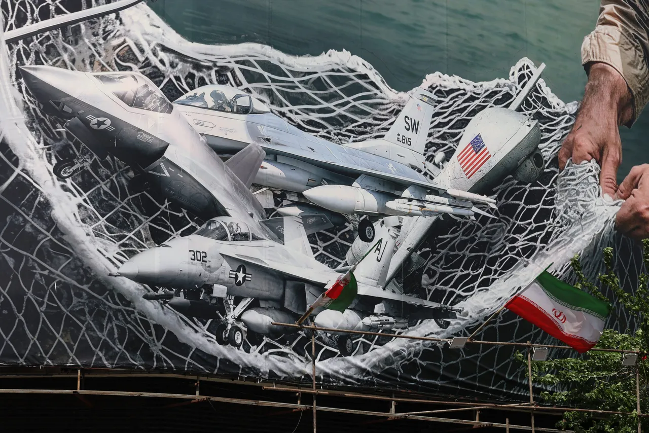 A giant billboard depicting Iranian troops using a net to catch US combat aircraft is seen at the Revolution Square in Tehran on April 28, 2026.(Photo by ATTA KENARE / AFP via Getty Images) 
