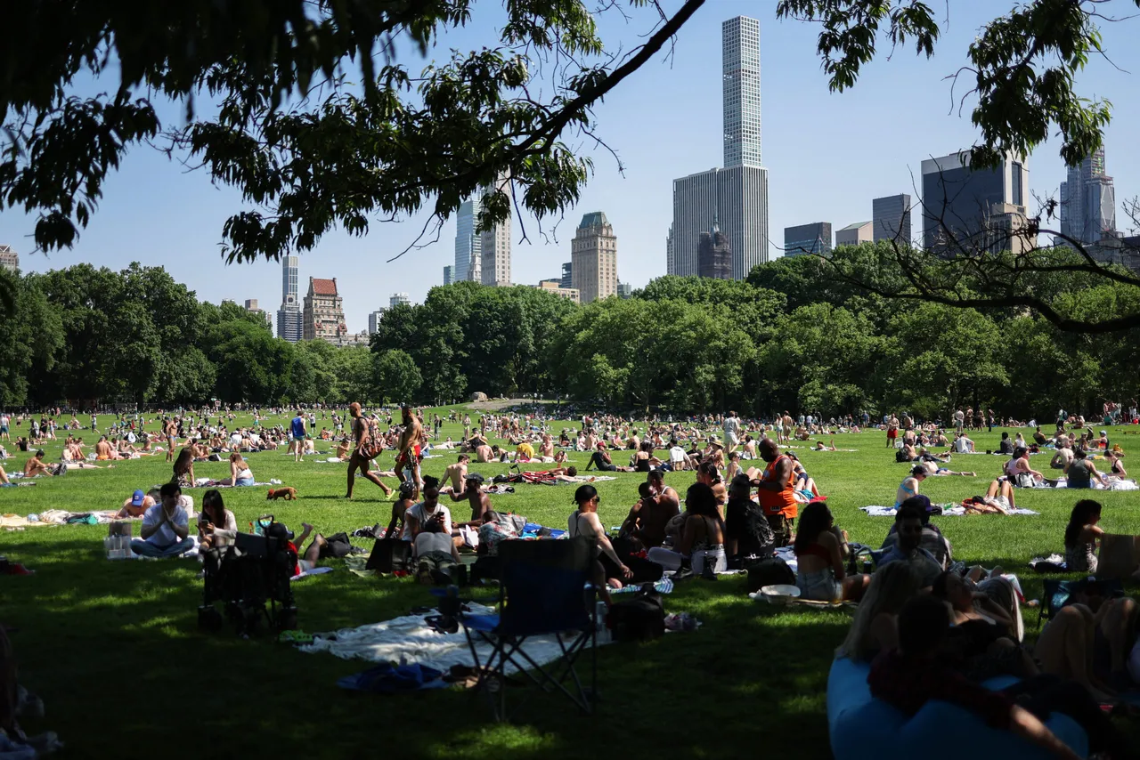 People sunbathe in Central Park in the Manhattan borough of New York city during Memorial Day weekend on May 26, 2024. (Photo by CHARLY TRIBALLEAU/AFP via Getty Images)