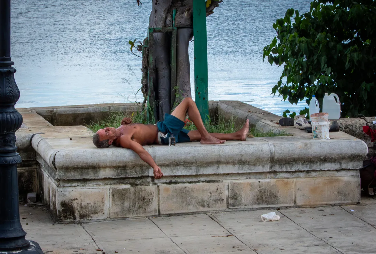 A man sleeps on the street in Havana on October 2, 2025. (Photo by Adalberto Roque/AFP via Getty Images)
